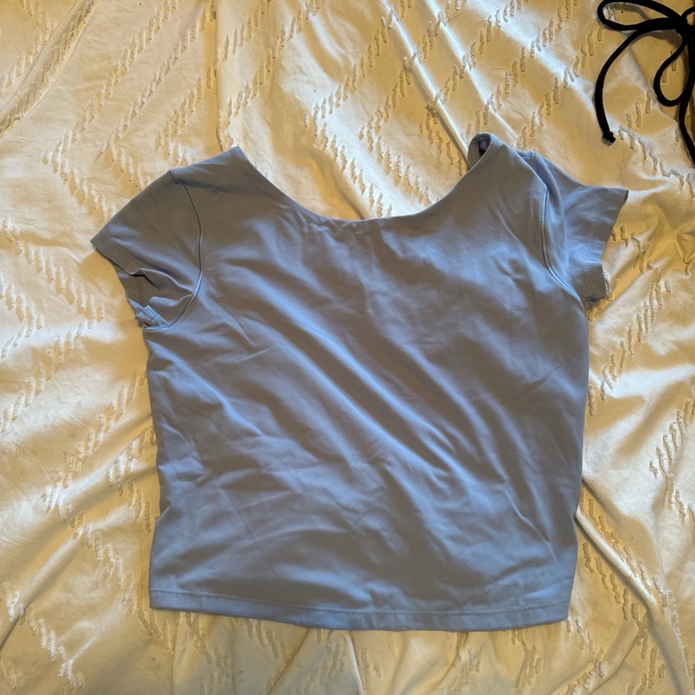 Active light blue top with open back